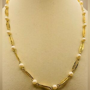 Sarah Coventry gold tone filigree and faux pearl necklace. 18 inches. Signed.